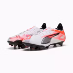 Side view of Puma ULTRA 5 Carbon FG soccer cleats in a white and red colorway, designed for firm ground play and maximum acceleration.