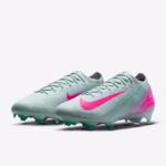 Side view of the Nike Mercurial Vapor 16 Elite FG soccer cleats in a multicolor design, placed against a neutral background