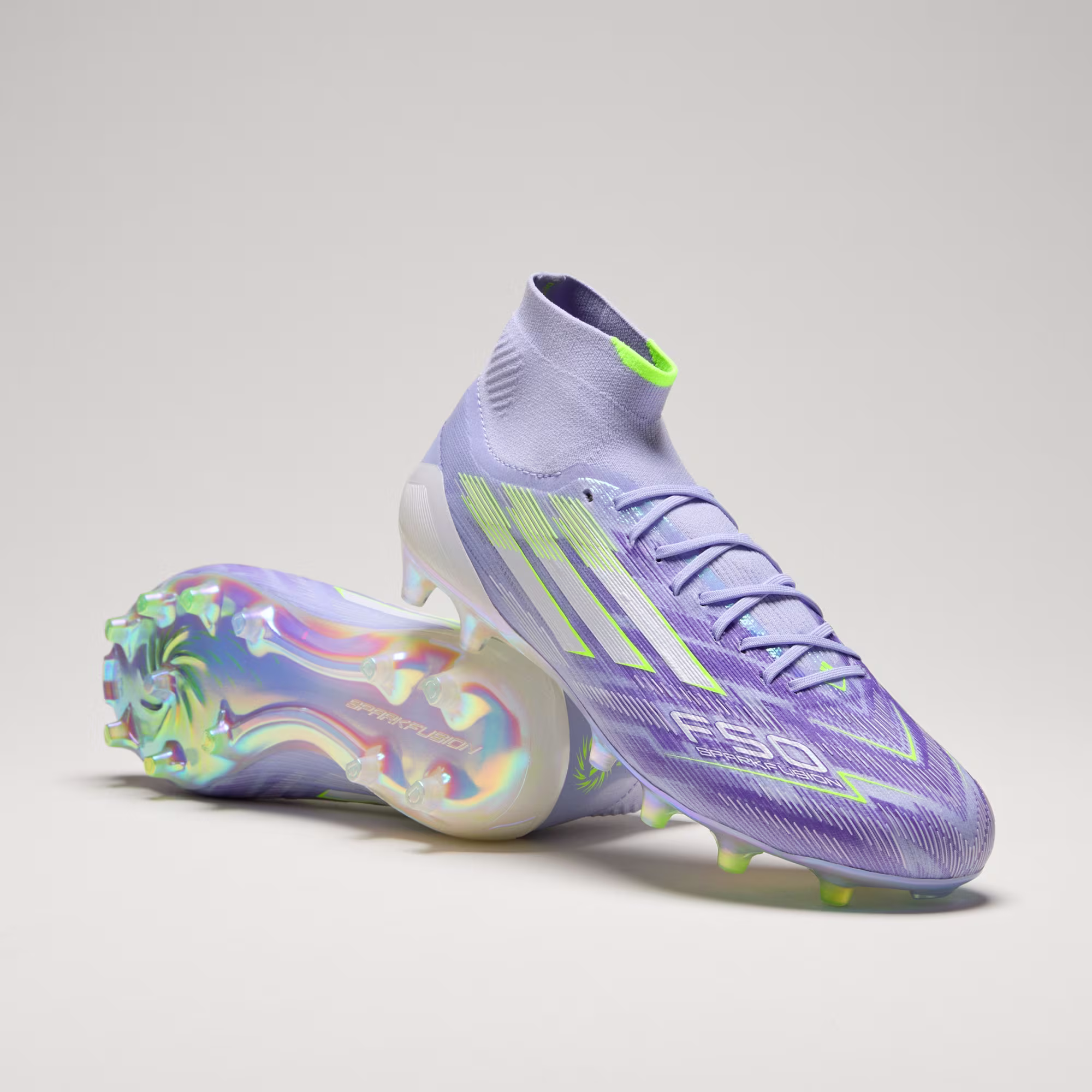 Adidas F50 Sparkfusion Elite Mid soccer cleats – purple and yellow colorway, firm/AG soleplate