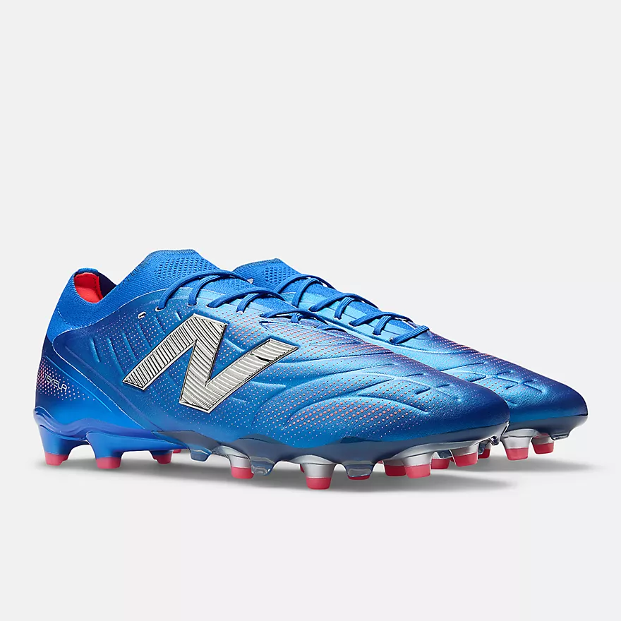New Balance Tekela v5 Elite FG – blue soccer cleats with red and silver details, laced version for creative control