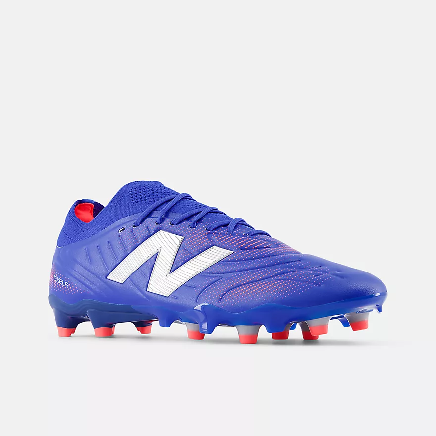 New Balance Tekela Pro v5 FG – blue soccer cleats with red studs and white ‘N’ logo, low-cut design for agile control