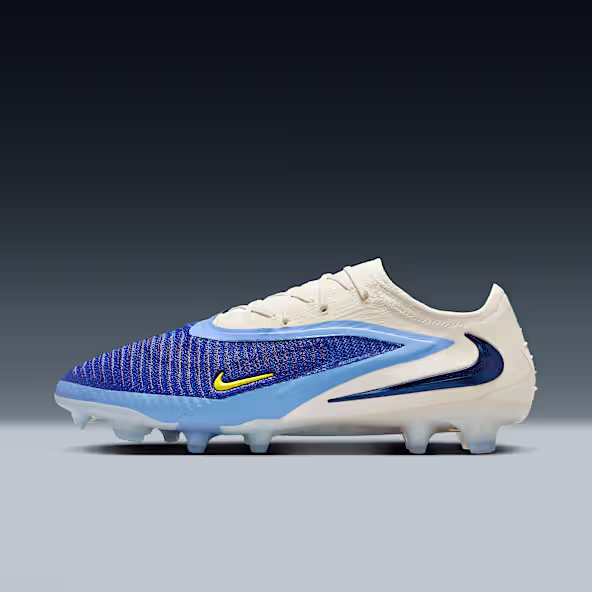 Nike Phantom soccer cleats in blue and white, designed for precision and control on multiple surfaces