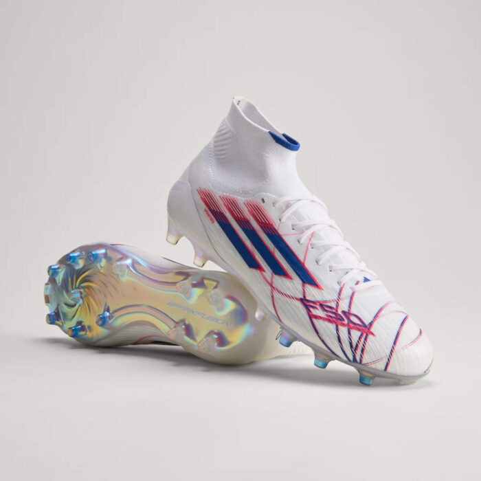 Adidas F50 Sparkfusion Elite Mid-Cut FG/AG women’s soccer cleats in white with blue and red accents.