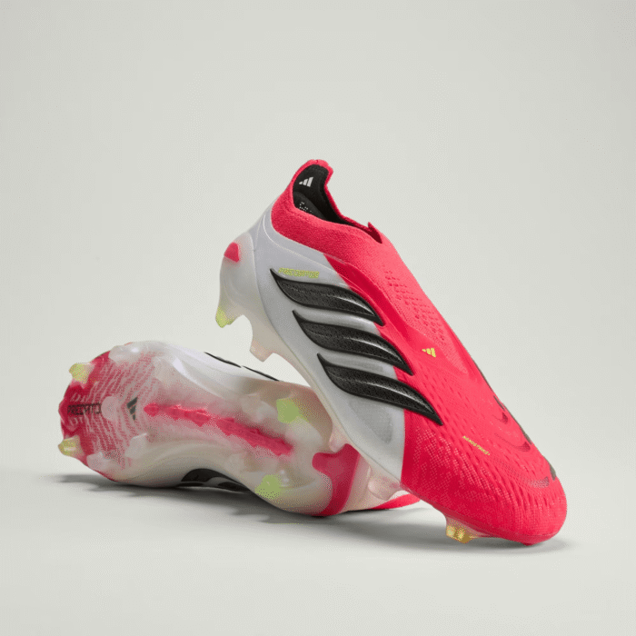 Adidas Predator Elite laceless firm ground soccer cleats with a red and black control-focused design.
